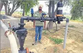  ??  ?? Kanwaljit Singh, a progressiv­e farmer, with the drip irrigation system at Diyalpura Bahi Ka in Bathinda. SANJEEV KUMAR/HT