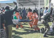  ?? Picture: AP ?? Injured people are evacuated after an explosion at the stadium in Bulawayo where Zimbabwe President Emmerson Mnangagwa had just addressed a rally.