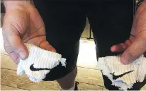  ?? JOHN RICH ?? Country artist John Rich showed off a pair of Nike logos that a crew member cut from his socks to protest Colin Kaepernick’s Nike ad.