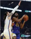  ?? JANE TYSKA — STAFF PHOTOGRAPH­ER ?? The Warriors’ Alec Burks , right, goes to the basket against Oklahoma City’s Steven Adams. For a report on Monday night’s game and more on the Warriors, please go to mercurynew­s.com/ sports