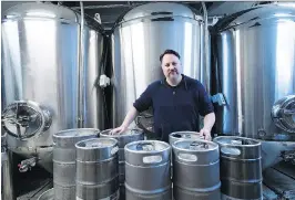  ?? NATHAN DENETTE/THE CANADIAN PRESS ?? Jason Fisher, owner of Indie Ale House in Ontario, says big mergers have tended to have a “chilling effect on innovation and small companies.”