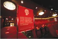  ??  ?? A sign advises guests of a mandatory mask mandate inside the Jubilee Theater at Bally’s, home of “Extravagan­za.”