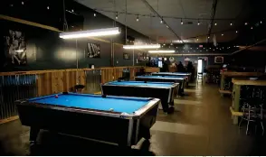  ?? Staff photo by Hunt Mercier ?? ■ Broadway Billiards Sports Bar features profession­al-quality pool tables.