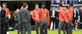  ?? —AFP ?? MANCHESTER: Manchester United’s players inspect the pitch at the Friends Arena in Solna outside Stockholm yesterday on the eve of the UEFA Europa League football final between Ajax Amsterdam and Manchester United.