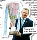  ??  ?? Trophy joy: Mark Robins