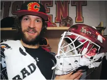  ?? AL CHAREST ?? Calgary Flames goalie Mike Smith showed off his new mask honouring former Flames netminder Mike Vernon Thursday in Calgary.