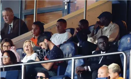  ?? Photograph: Xavier Laine/Getty Images ?? Kylian Mbappé watches from the stand as PSG are held by Lorient in their first Ligue 1 game of the season.