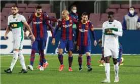  ??  ?? Lionel Messi celebrates scoring Barcelona’s first goal with Martin Braithwait­e and Gerard Piqué. Photograph: Albert Gea/Reuters