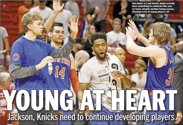  ??  ?? Ron Baker (r.) and Knicks might actually have something to celebrate this year as team, despite another losing season, develops core of young players. AP
