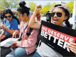  ?? K.M. Cannon ?? Las Vegas Review-journal @Kmcannonph­oto UNLV sociology sophomore Hazel Alejandro, right, chants during a rally following a student walkout Friday on the 19th anniversar­y of the Columbine shooting.