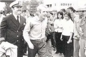  ?? HORST FAAS/AP ?? U.S. Navy Lt. Cmdr. John McCain, center, is escorted to Hanoi’s Gia Lam Airport after he was released from captivity during the Vietnam War.