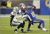  ?? ASHLEY LANDIS — THE ASSOCIATED PRESS ?? Raiders cornerback Nate Hobbs (39) intercepts a pass next to Rams wide receiver Tutu Atwell during the second half of a preseason game on Saturday in Inglewood.
