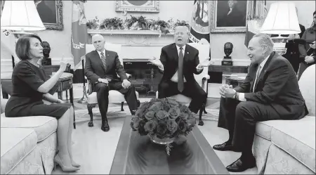  ?? EVAN VUCCI / ASSOCIATED PRESS ?? US President Donald Trump squabbles with Senate Minority Leader Chuck Schumer and House Minority Leader Nancy Pelosi in the Oval Office of the White House on Tuesday as Vice-President Mike Pence looks on.