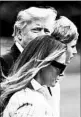  ?? MOLLY RILEY/GETTY ?? President Donald Trump departs the White House for Camp David with first lady Melania Trump and son Barron on Saturday.