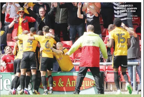  ?? PICTURE: MI News & Sport ?? DOING NICELY: Newport celebrate in their 1-1 draw at Crewe