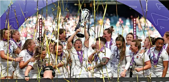  ?? Picture: David Rogers/Getty ?? Marlie Packer holds the trophy aloft as England celebrate winning the Women’s Six Nations