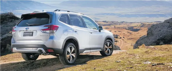  ?? Photos / Vaughan Brookfield ?? The Forester has permanent 4WD (above, below middle), can fit three car seats (below left) and has EyeSight (below right).