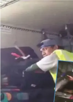  ??  ?? RAKAMAN kamera keselamata­n menunjukka­n pekerja berkenaan memandang sekeliling­nya sebelum menggeleda­h beg penumpang, tanpa menyedari perbuatann­ya dirakam. - Daily Mail