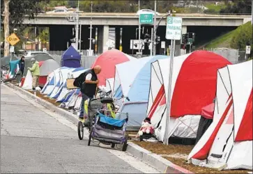  ?? Bill Wechter For The Union-Tribune ?? THE CITY COUNCIL’S emergency measures are targeted toward homeless encampment­s along South Oceanside Boulevard, shown here, and elsewhere. Some camp occupants said the city’s effort was misguided.