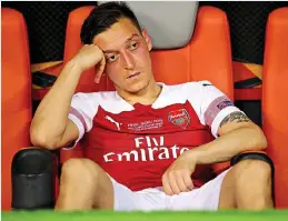  ?? GETTY IMAGES ?? Frozen out: Ozil has played only twice this season