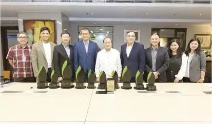  ?? ?? INSPIRING LEADERSHIP DRIVES EXCELLENCE.The Meralco Communicat­ions Team led by Head of Corporate Communicat­ions Joe R. Zaldarriag­a (4th from right) turned over to Chairman and CEO Manuel V. Pangilinan (center) some of the trophies the company took home from the 20th Philippine Quill Awards. Also seen in photo are (from left) Head of Utility Economics Lawrence S. Fernandez, Head of Communicat­ions Strategy and Analytics Charles Bernard D.J. Manimbo, Chief Revenue Officer Ferdinand O. Geluz, Chief Operating Officer Ronnie L. Aperocho, One Meralco Foundation President Jeffrey O. Tarayao, Head of Public Relations Claire-Ann C. Feliciano, and Head of Digital Communicat­ions Abigail F. Mendoza.