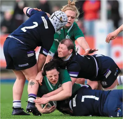  ?? DAVID FITZGERALD/SPORTSFILE ?? Ireland’s Paula Fitzpatric­k is tackled by Sarah Bonar, above, and Lana Skeldon of Scotland during yesterday’s clash at Donnybrook