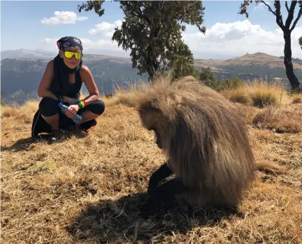  ??  ?? MONKEYING AROUND Marie-christine Leelouey hanging out with a gelada baboon in Ethiopia