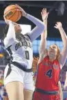  ?? STAFF PHOTO BY MATT HAMILTON ?? Bradley Central’s Kimora Fields shoots over Cookeville’s Macy Hudson during Friday’s game at Middle Tennessee State.