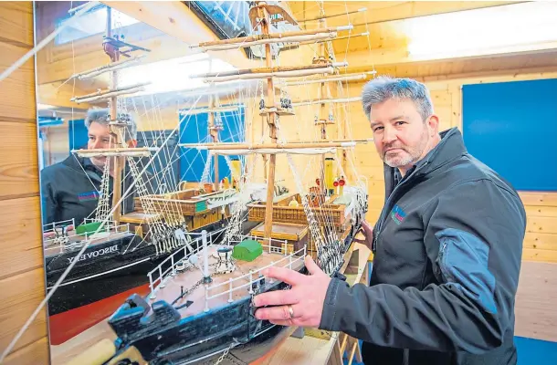  ??  ?? HULL NEW SHIP: Norman Sutherland alongside the model of RRS Discovery he refurbishe­d during lockdown. Picture by Steve Macdougall.