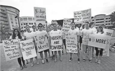  ?? THE COMMERCIAL APPEAL ?? Men and women in high heels walked up Beale Street and one mile around downtown for the 6th annual Walk a Mile in Her Shoes event in 2016. STAN CARROLL /