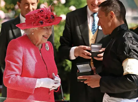  ?? Charlie Crowhurst/Getty Images ?? > Frankie Dettori, right, with Queen Elizabeth II at Royal Ascot in 2018 and, below, riding in Her Majesty’s famous racing silks