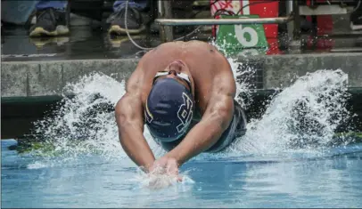  ?? Katherine Quezada/ The Signal ?? West Ranch’s Gabe Eke competes in the 100-yard backstroke during the Foothill League finals recently held at the Santa Clarita Aquatics Center. Eke finished first in the 50-yard freestyle.