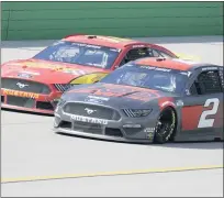  ??  ?? Ryan Blaney, left, and Brad Keselowski drive during Sunday’s NASCAR Cup Series race at Kentucky Speedway. Keselowski made contact with Jimmie Johnson following a restart later in the race when Johnson tried to maneuver around Blaney.