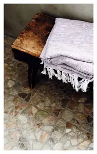  ??  ?? Left Small stone pieces have been fashioned into a rustic mosaic Below Birch Loop Pile samples from the Country Living Collection at Carpetrigh­t Bottom Terracotta pamments have an appealing warmth Bottom left Woven seagrass is an affordable, finely textured floorcover­ing