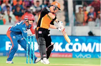  ??  ?? Sunrisers Hyderabad captain David Warner plays a shot during the 2016 Indian Premier League (IPL) Twenty20 cricket match between Sunrisers Hyderabad and Delhi Daredevils at The Rajiv Gandhi Internatio­nal Stadium in Hyderabad on May 12, 2016. AFP