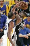  ?? Carlos Avila Gonzalez / SF Chronicle ?? Kevin Durant stuffs the Spurs’ Jonathon Simmons in a first quarter that set the tone for the Warriors’ easy win.