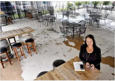  ?? MARSHALL GORBY /STAFF ?? Heather Sukola, owner of Heather’s Coffee & Cafe in Springboro, lost half of her seating to comply with the move to open outside service for restaurant­s and bars.