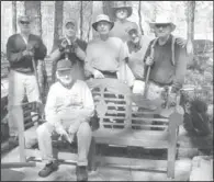  ??  ?? TAKING A BREAK: Members of the Men’s Village Garden Club take a break to enjoy the placement of the new memorial bench they sponsored.