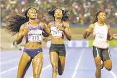  ??  ?? Elaine Thompson (left) of Jamaica competes during the Jamaica Internatio­nal Invitation­als IWC Meet in women’s 200m run at National Stadium, Kingston, Jamaica. — Reuters photo