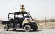  ??  ?? A mobile detection assessment response system patrols the perimeter of an airfield.