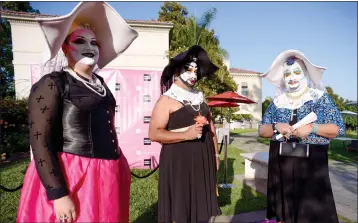  ?? PHOTO BY SARAH REINGEWIRT­Z — PASADENA STAR-NEWS ?? Los Angeles Sisters of Perpetual Indulgence members, from left, Rocky Bautista as “Novice Sister Babs,” Raul Aragon as “Sister Latina Turner” and Manny Godox as “Fatty Ma of Skid Row” attend The Huntington's first-ever party celebratin­g the LGBT community on June 6, 2014.