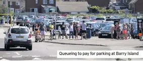  ??  ?? Queueing to pay for parking at Barry Island