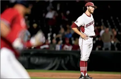  ?? NWA Democrat-Gazette/J.T. WAMPLER ?? Arkansas pitcher Josh Alberius waits as Mississipp­i second baseman Tate Blackman heads home after hitting a home run in the ninth inning of Thursday’s game at Baum Stadium in Fayettevil­le. The Rebels hit four home runs in the game as they blew past the...