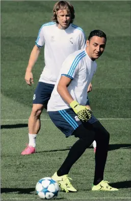  ?? PICTURE: AP ?? Real Madrid’s goalkeeper Navas controls the ball in front of Luka Modric during training in Madrid this week. Real will play Shakhtar Donetsk at the Bernabeu tonight in a Group A Champions League match.