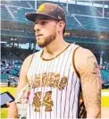  ?? ANNIE HEILBRUNN FOR THE U-T ?? Padres pitcher Joe Musgrove talks before Monday’s game while wearing a jersey like the ones he gifted to his fellow starters.