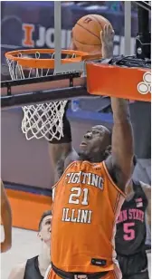  ?? AP ?? Illinois center Kofi Cockburn dunks during the first half Tuesday against Penn State in Champaign. He led the Illini with 21 points and 12 rebounds.