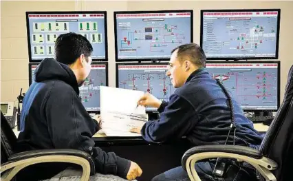  ?? Calpine ?? Calpine employees work in the control room at the company’s York Energy Center in Pennsylvan­ia. Since 2010, the company has expanded in the mid-Atlantic and New England.