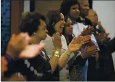  ??  ?? Democratic presidenti­al candidate Sen. Kamala Harris, D-Calif., center, attends a Corinthian Baptist Church service Aug. 11, 2019 in Des Moines, Iowa.