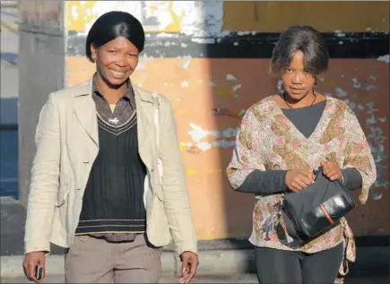  ?? PICTURE: LEON LESTRADE ?? CHARGED: Evelina Fortuin and Denise Muller walk across the Grand Parade as they make their way from the Cape Town Magistrate’s Court, where they appeared, alongside three others in connection with charges of rape, human traffickin­g and sexual...