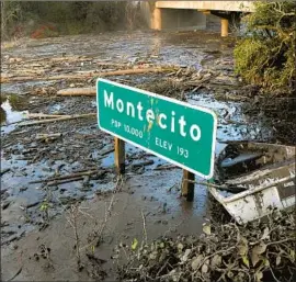  ?? Michael Owen Baker For The Times ?? THE THOMAS fire killed two people and scorched the Montecito hills in Santa Barbara County. A rainstorm later triggered a mudslide that left 21 more dead.